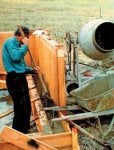 Bill tamping the first wall pour.jpg